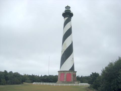 Cape Hatteras Lighthouse, tall with black stripe winding up from the brick base