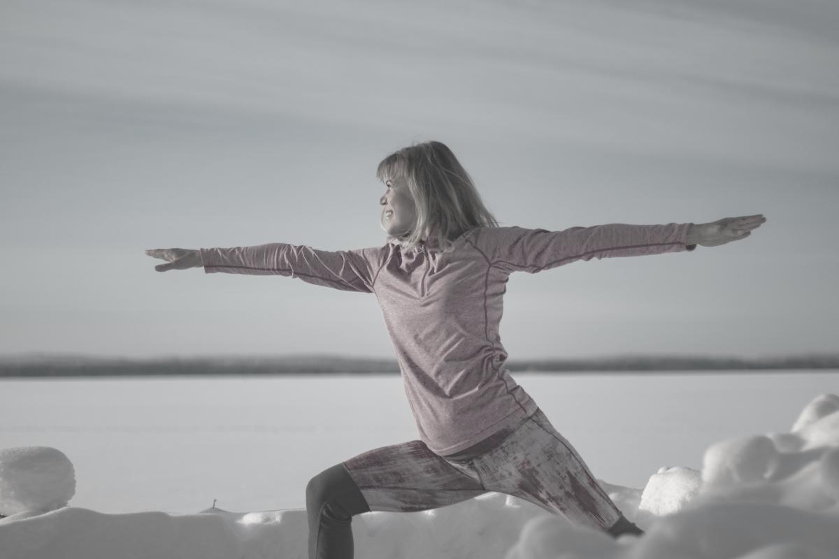 woman in the yoga warrior pose